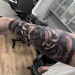 Steve_crane_tattoo_tiger_eyes_forearm